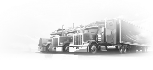 Three large semi-trucks parked side by side under a cloudy sky.