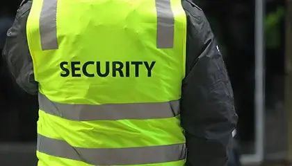 Security guard wearing a high-visibility vest