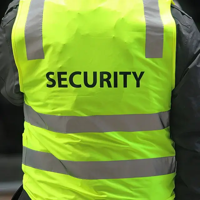 Security guard in reflective safety vest