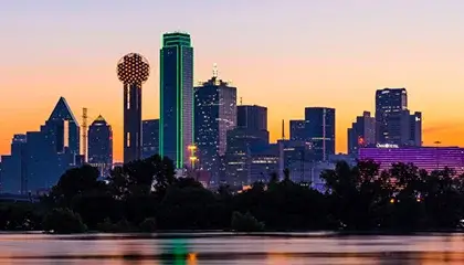 Dallas skyline at sunset with water reflection