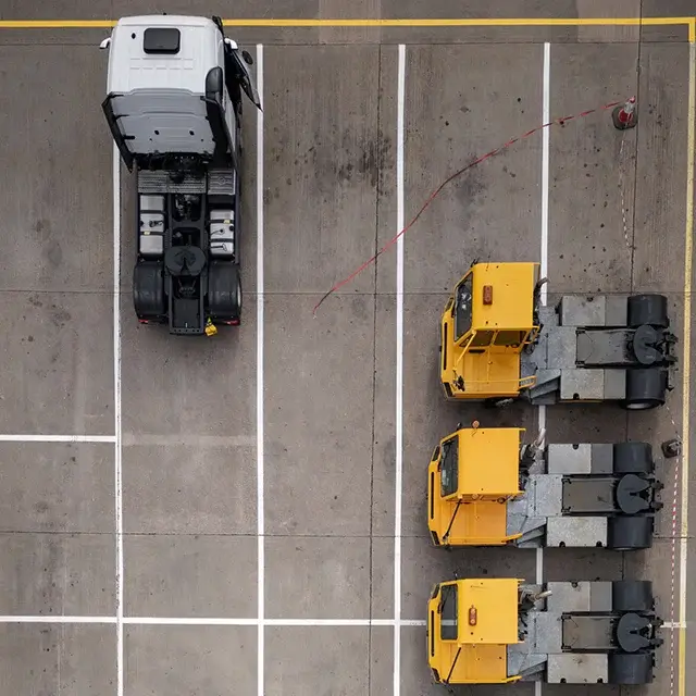 Yard jockey trucks parked on a lot