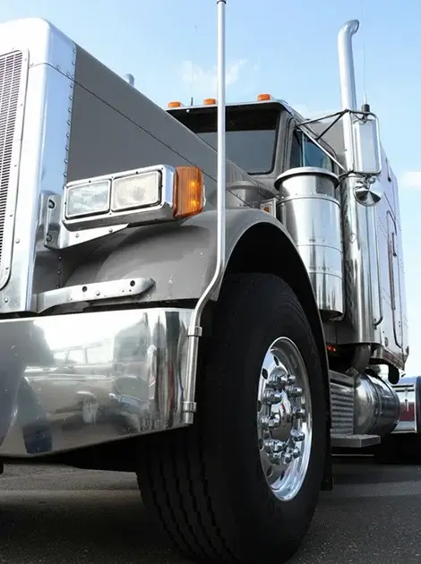 D. OTHERWISE: Close up of a silver semi-truck front